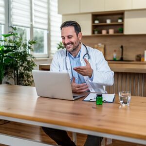 Telemedicine video consultation on a laptop (brand-neutral)